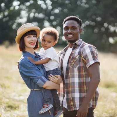 Adorable Multiracial Parents Posing With Cute Son Adorable Multiracial Parents Posing With Cute Son