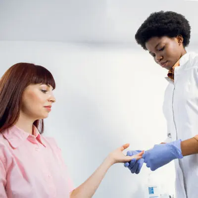 Concentrated Young Afro American Woman Doctor Doing Drug Screening Concentrated Young Afro American Woman Doctor Doing Drug Screening
